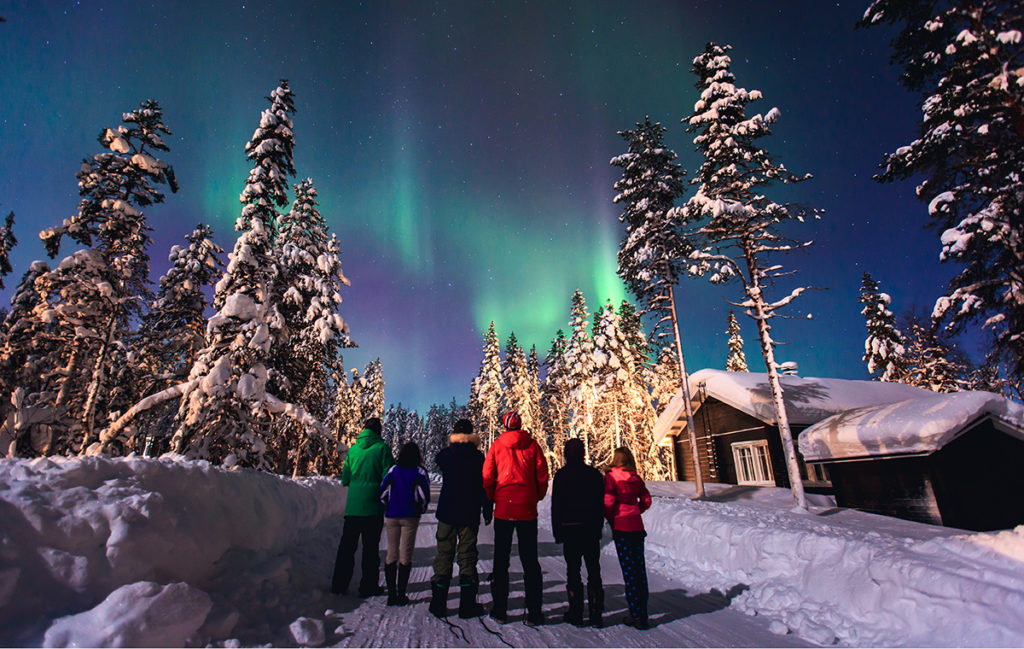 Pilgrims watching northern lights in Lapland, Scandinavia